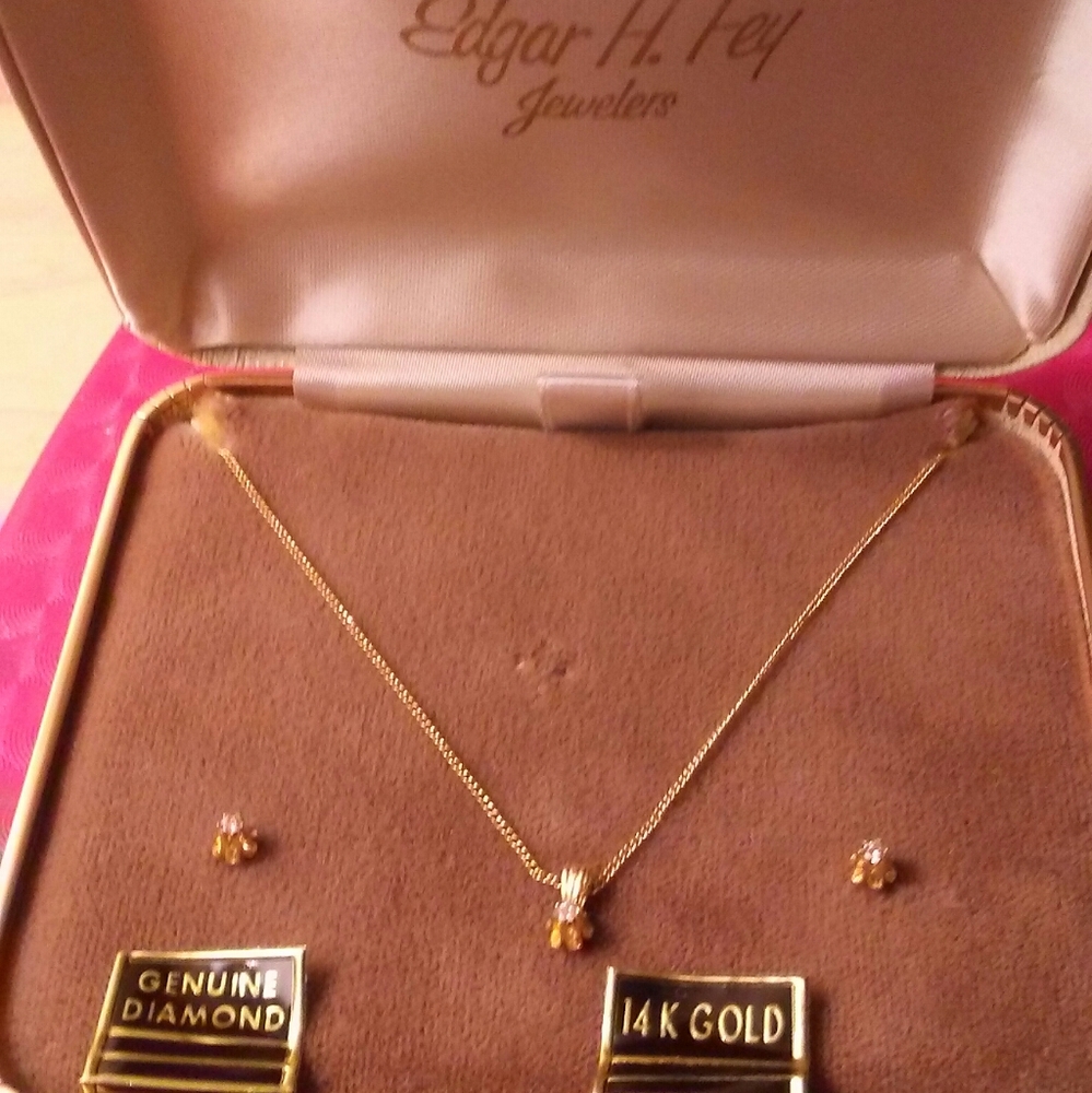 Gold necklace with genuine diamond chip.